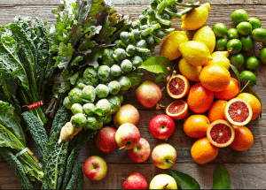 a group of fruits and vegetables on a wood surface Healthy Weight Loss Diets Uttoxeter